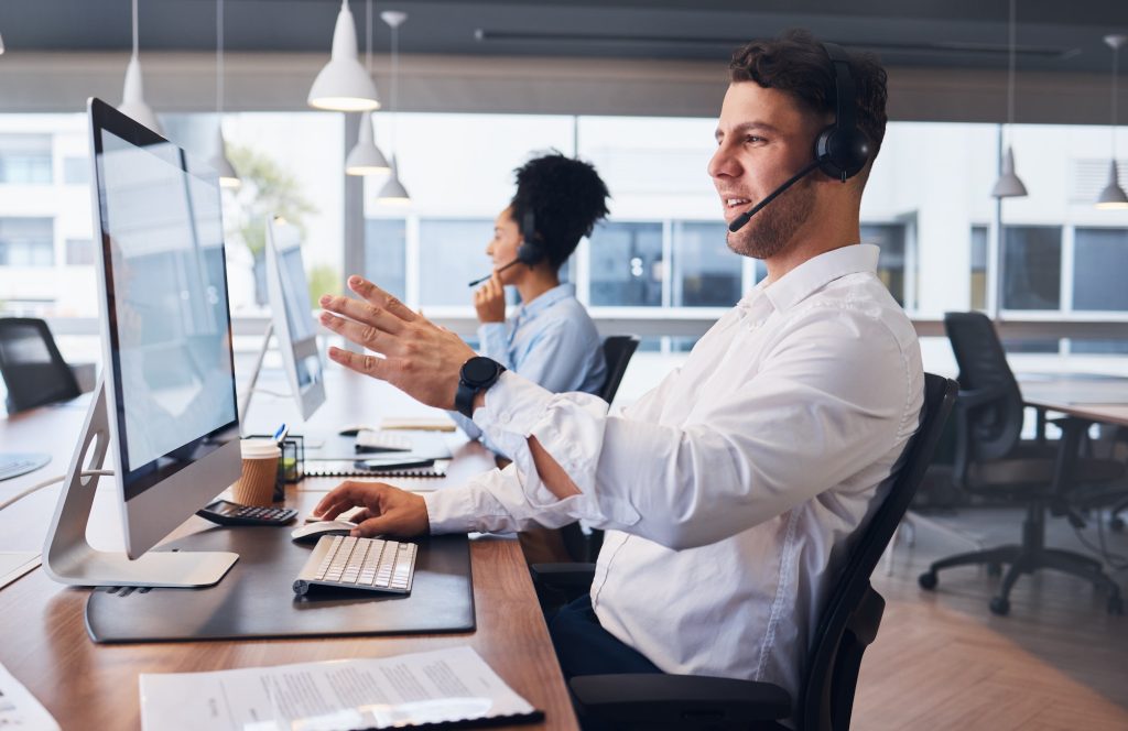 Call center, team and businessman in office for crm, customer service or telemarketing. Online supp