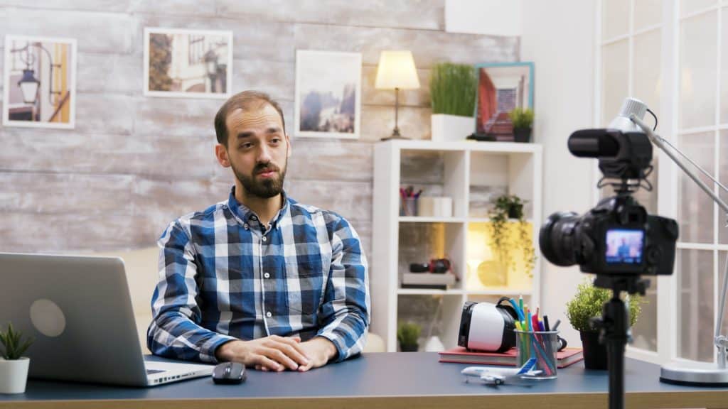 Caucasian vlogger recording a podcast for social media